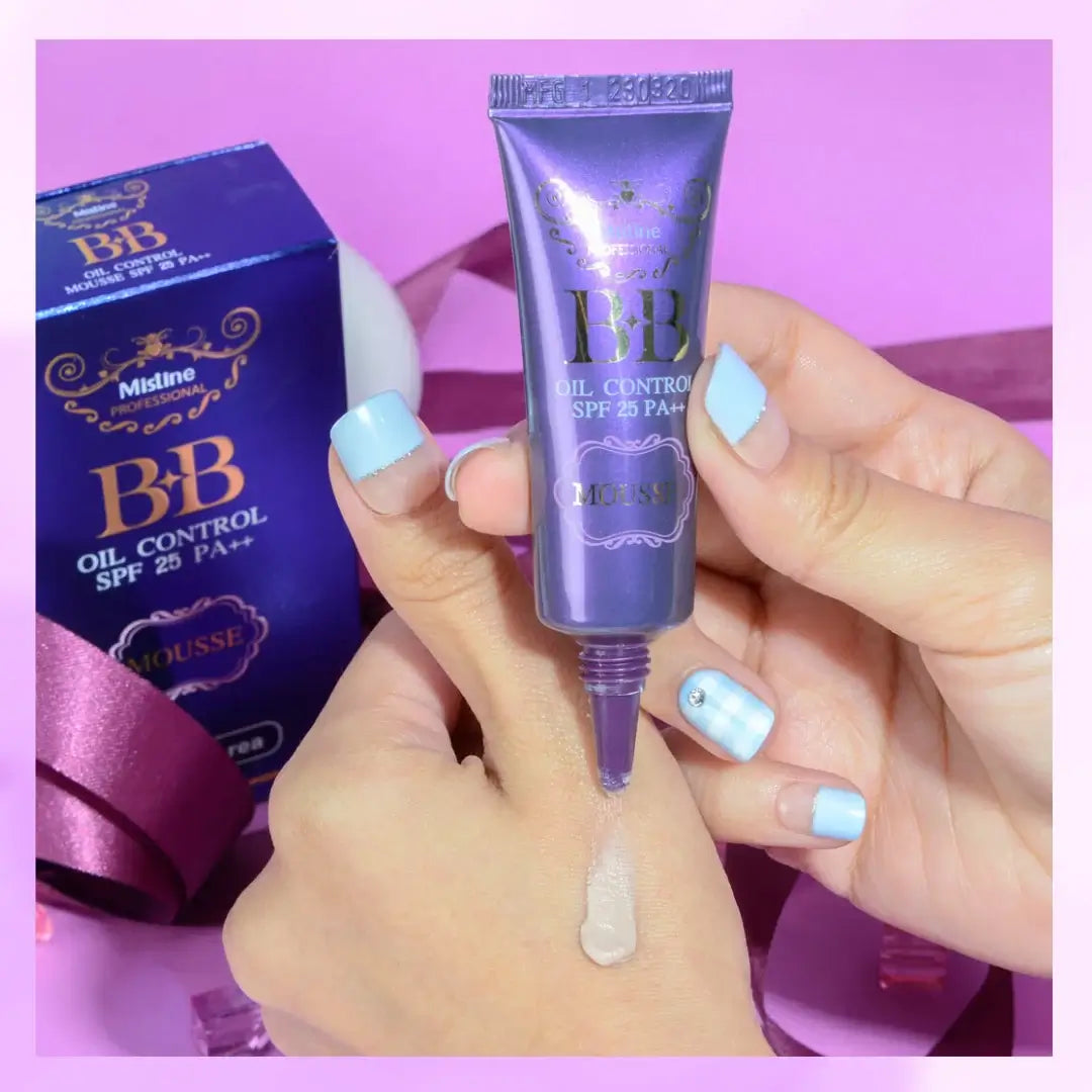 Mistine BB Mousse nozzle tip held in hand with retail packaging box