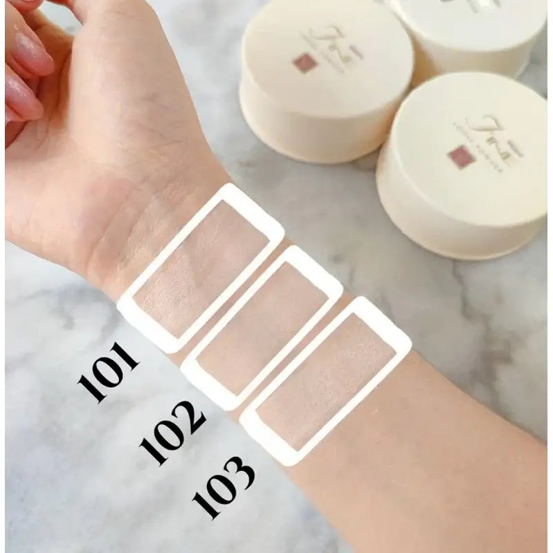 Mistine Fine Loose Powder shades 101 102 103 skin color swatches on forearm