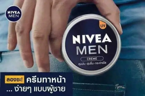 NIVEA MEN Creme UV Oil Control Soft Skin Moisture for face body hands in a hand holding the product.