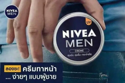 NIVEA MEN Creme UV Oil Control Soft Skin Moisture for face body hands in a hand holding the product.