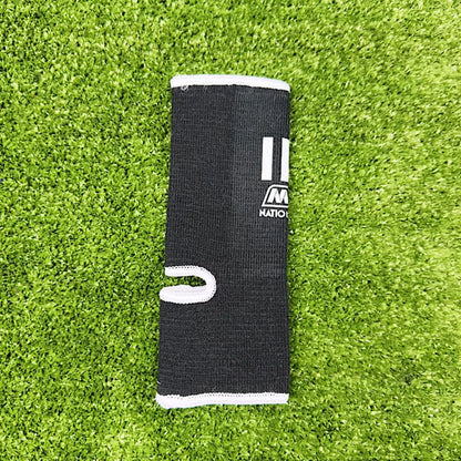 Nationman Ankle Guard support shown on grass background, ideal for Muay Thai and MMA athletes.