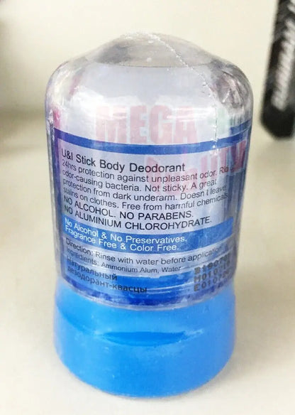 Natural Alum Deodorant Stick on a surface, clearly showing the product details on the label.
