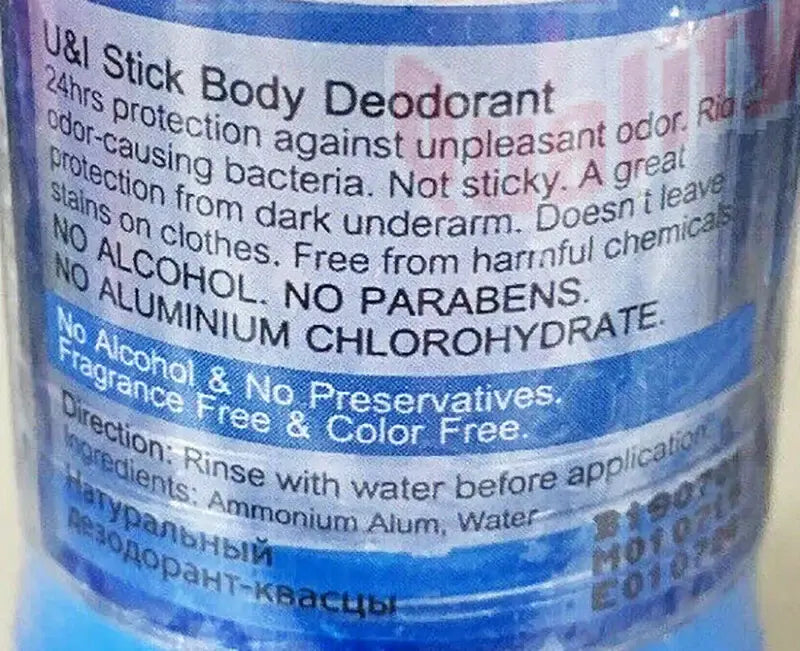 Natural Alum Deodorant Stick label close-up, detailing text in Thai and English about ingredients and usage.