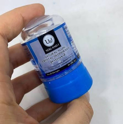 Natural Alum Deodorant Stick U&I Crystal 45g Alcohol Free Natural in a hand showing the product packaging.