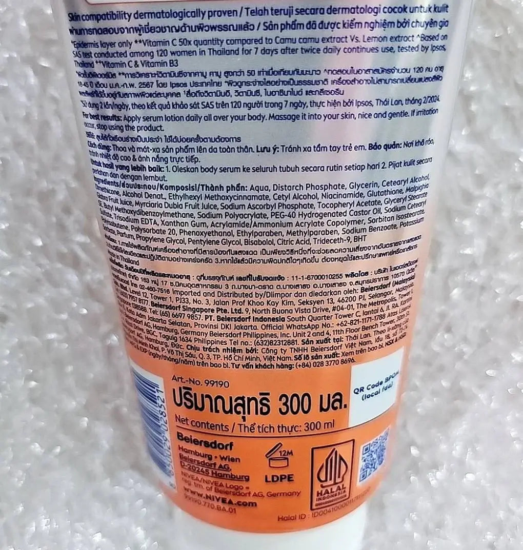 Nivea Extra Bright C E Vitamin Body Serum 300ml packaging with ingredient details and usage instructions.
