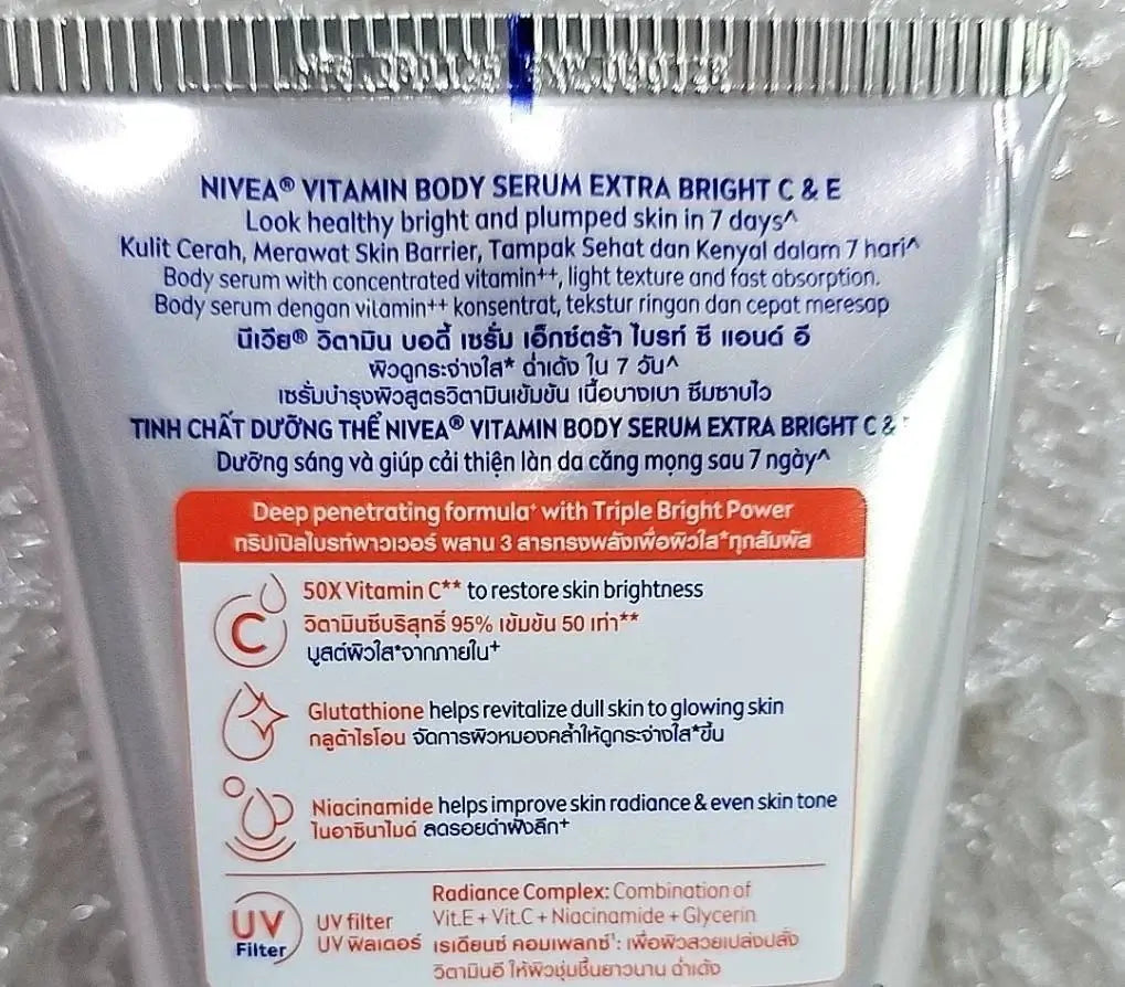 Nivea Extra Bright C E Vitamin Body Serum packaging showcasing features and benefits, promoting healthy, bright skin in 7 days.