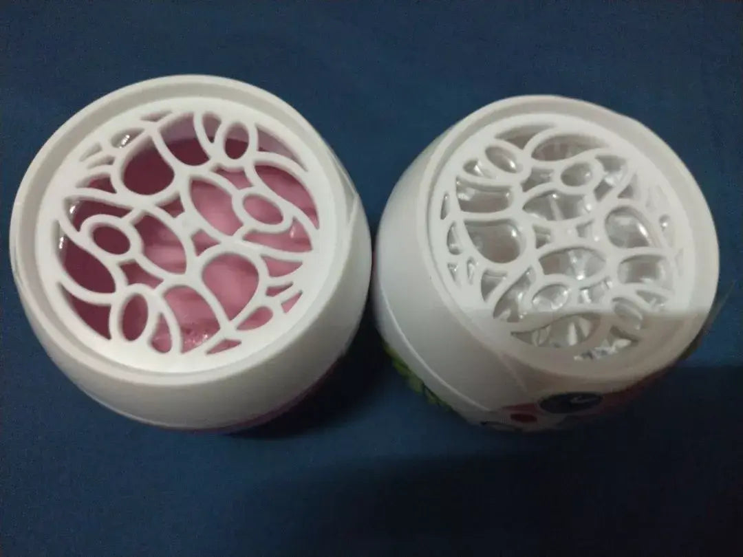 Two OASIS Mosquito Repellent Gel containers with different lid designs, showcasing the gel inside, on a blue background.