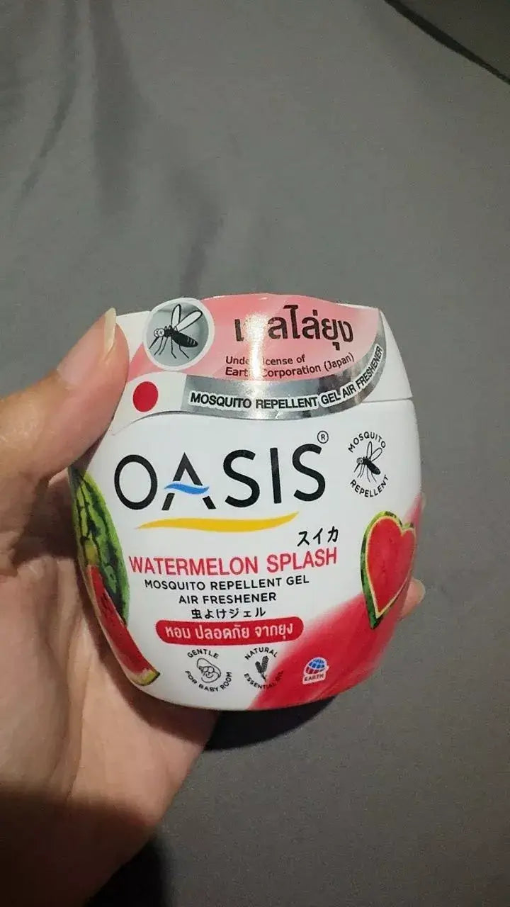 OASIS Mosquito Repellent Gel Watermelon Splash container held in hand