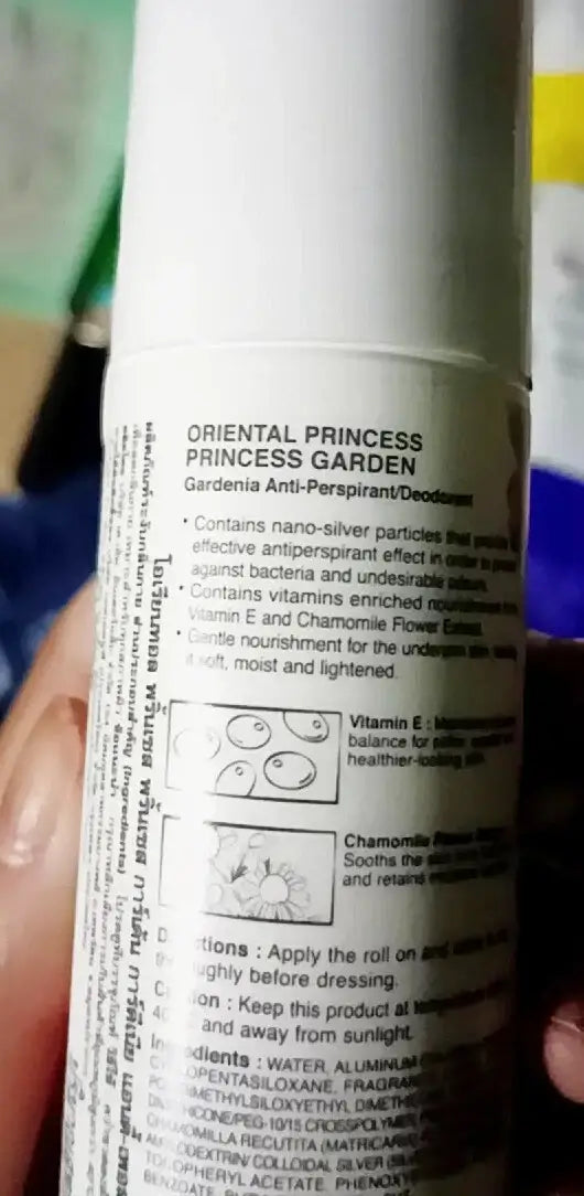 Side view of Oriental Princess Garden Gardenia roll-on bottle with product details