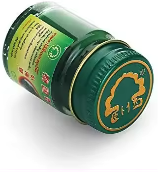 Top view of Phoyok balm showing green lid and seal