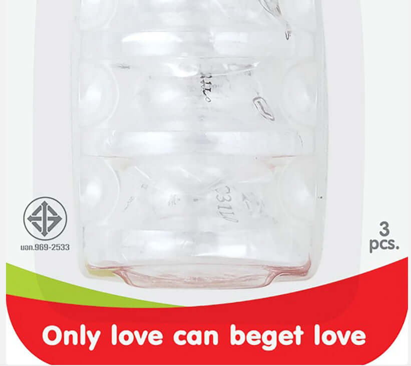 Close-up of the lower half of the Pigeon Silicone Nipple front packaging highlighting the clear teats and the product slogan.
