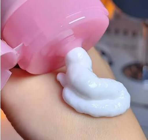 R Series Hand Body Lotion rich white cream texture dispensed on hand