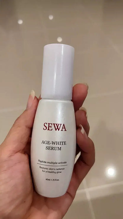 SEWA Age White Serum bottle in hand, promoting skin radiance and youthful glow with peptide formula.