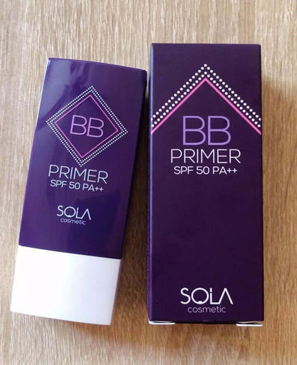 Real-world product shot of SOLA BB Primer in both sachet form and its corresponding purple product box, displayed together.