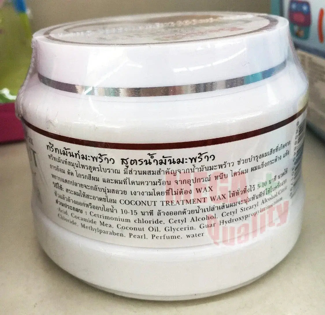 A close-up view of the ingredients and detailed text on the back of a Sense Coconut Hair Treatment plastic jar.