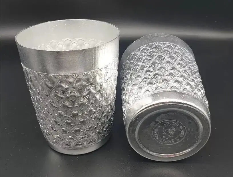 Thai Aluminum Cup set showing upright and bottom base views of traditional silver tumblers.