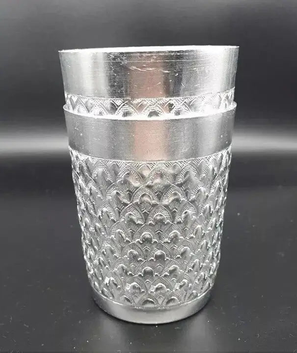 Thai Aluminum Cup clear front profile view displaying detailed Thai embossed craftsmanship.