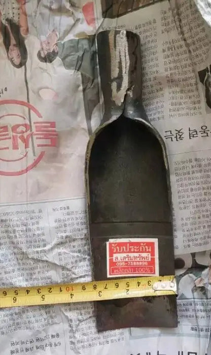 Close-up view measuring the curve and socket width of a Thai Spade Head Shovel steel digging blade with a tape measure.