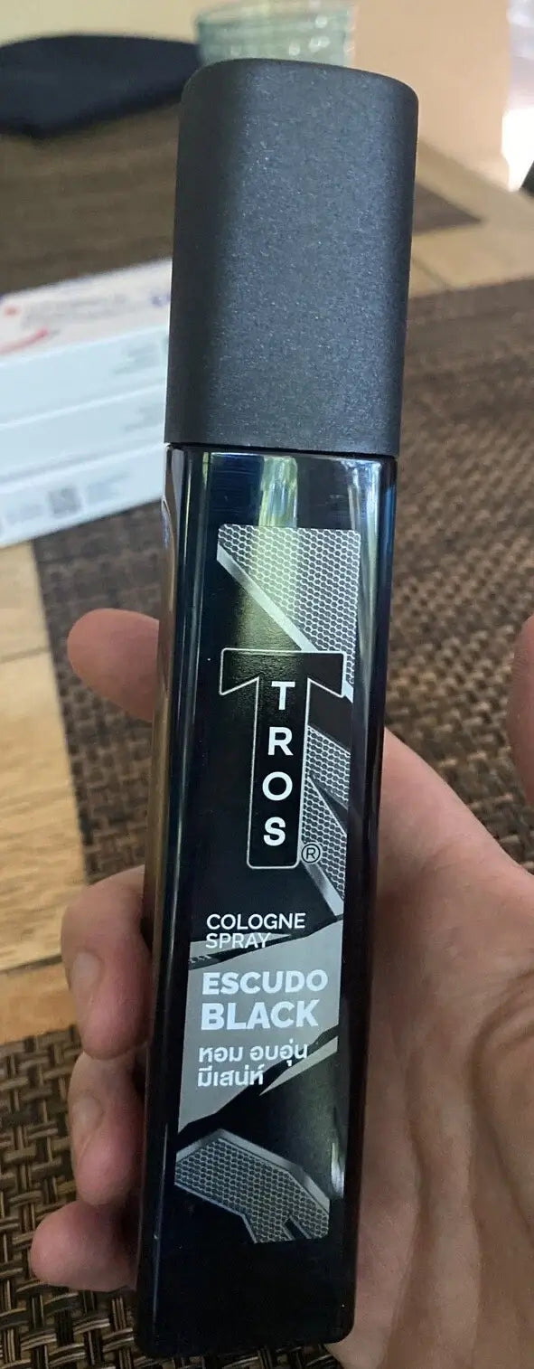 Tros Escudo Cologne Spray showcasing the black bottle design, ideal for men who enjoy warm, charming fragrances.