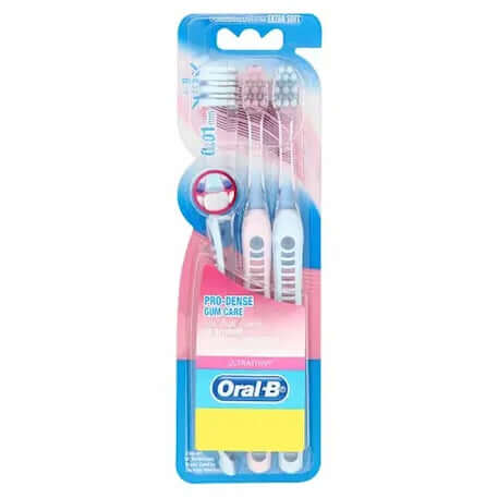 Oral B Gum Care Toothbrush Pro-dense Extra Soft 3 pack display showing bristle design and packaging.