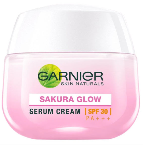 Close-up of Garnier Sakura Glow Pinkish Glow Serum Cream SPF30 in pink jar.