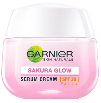 Close-up of Garnier Sakura Glow Pinkish Glow Serum Cream SPF30 in pink jar.