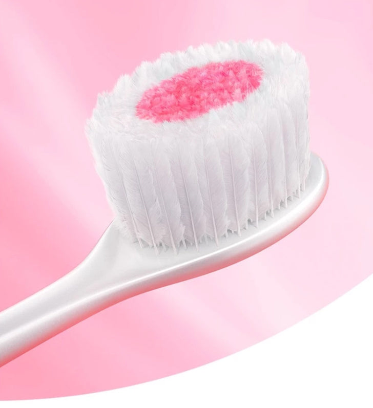 Colgate Cushion Clean Toothbrush close-up showing cushioned soft bristles with pink center for gentle deep clean
