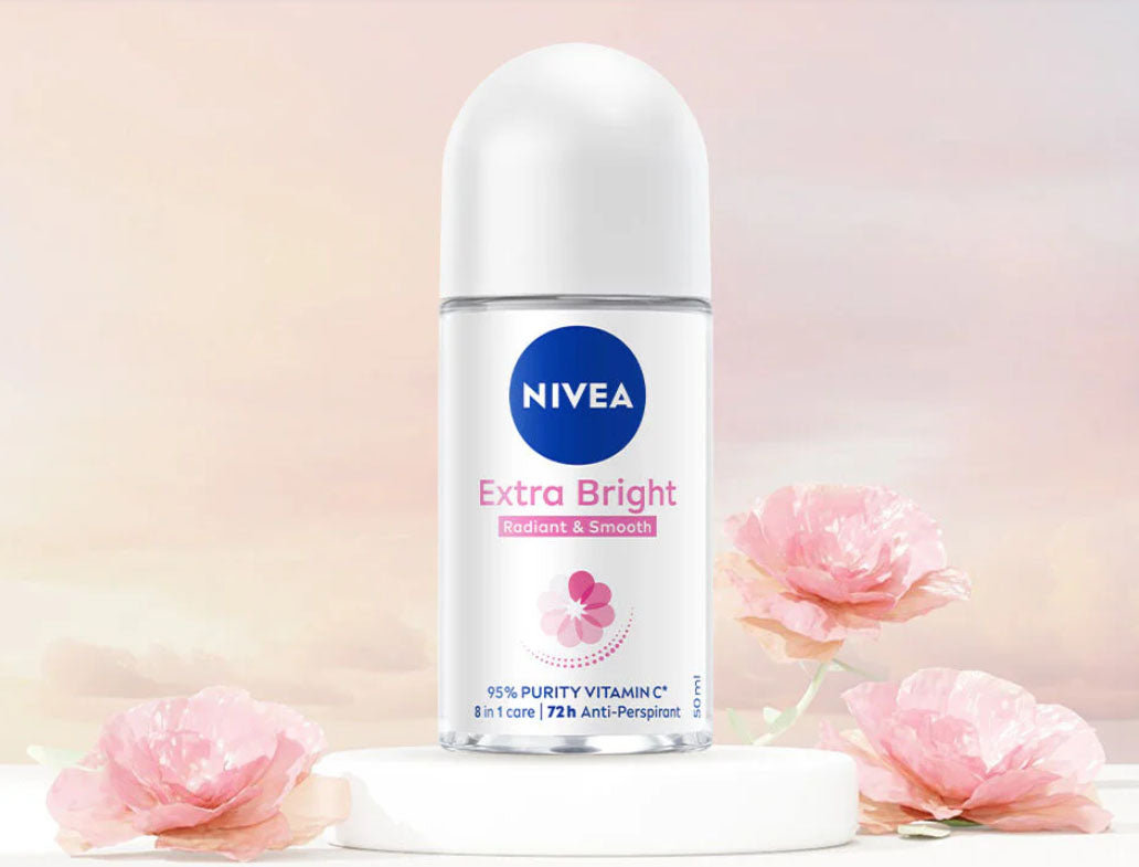 NIVEA Extra Bright Roll On placed on soft pink background aesthetic