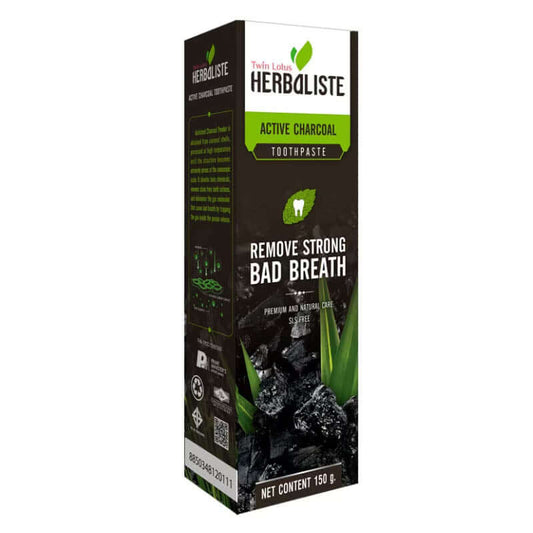 Top view of Twin Lotus Herbaliste Charcoal toothpaste packaging, illustrating the odor-trapping activated charcoal technology.