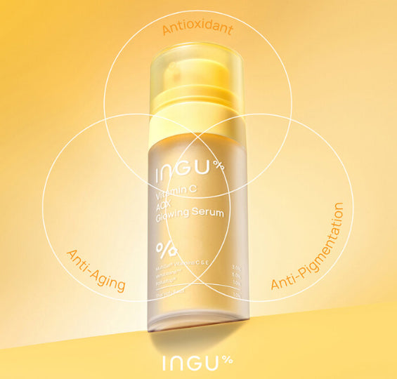 INGU Vitamin C AOX glowing serum shown with bright golden swirl background