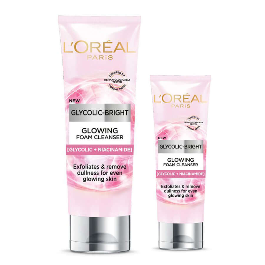 Two different sized pink tubes of LOreal Glycolic Bright Cleanser on a white background.