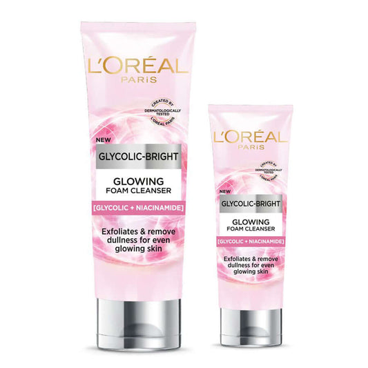 Two different sized pink tubes of LOreal Glycolic Bright Cleanser on a white background.