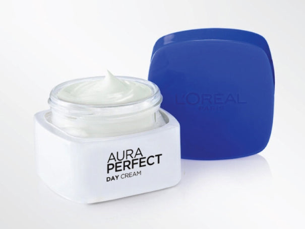 Open jar of L'Oréal Paris Aura Perfect Day Cream with visible cream inside