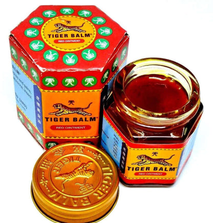 Tiger Balm Red ointment jar and packaging, extra-strength herbal pain relief balm for muscle and headache relief.