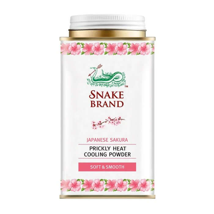 Snake brand prickly heat powder Soft Smooth Japanese Sakura 140g front view showing cherry blossom design and pink floral packaging.