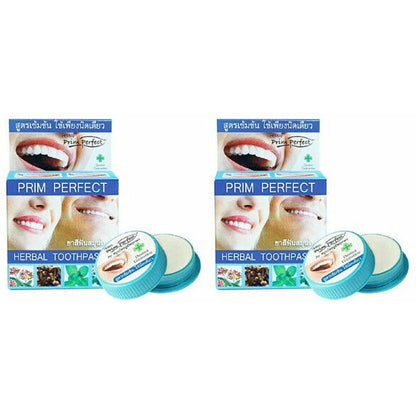 Two packs of Prim Perfect Thai Herbal Toothpaste 5g Strong Formula Clove with product jar lids visible