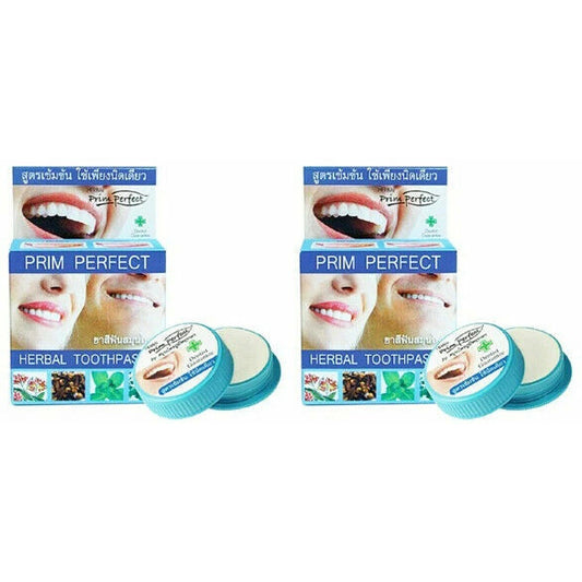 Two packs of Prim Perfect Thai Herbal Toothpaste 5g Strong Formula Clove with product jar lids visible