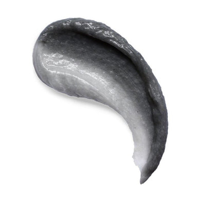 Garnier Men TurboBright Foam black charcoal texture demonstrating deep cleansing action.