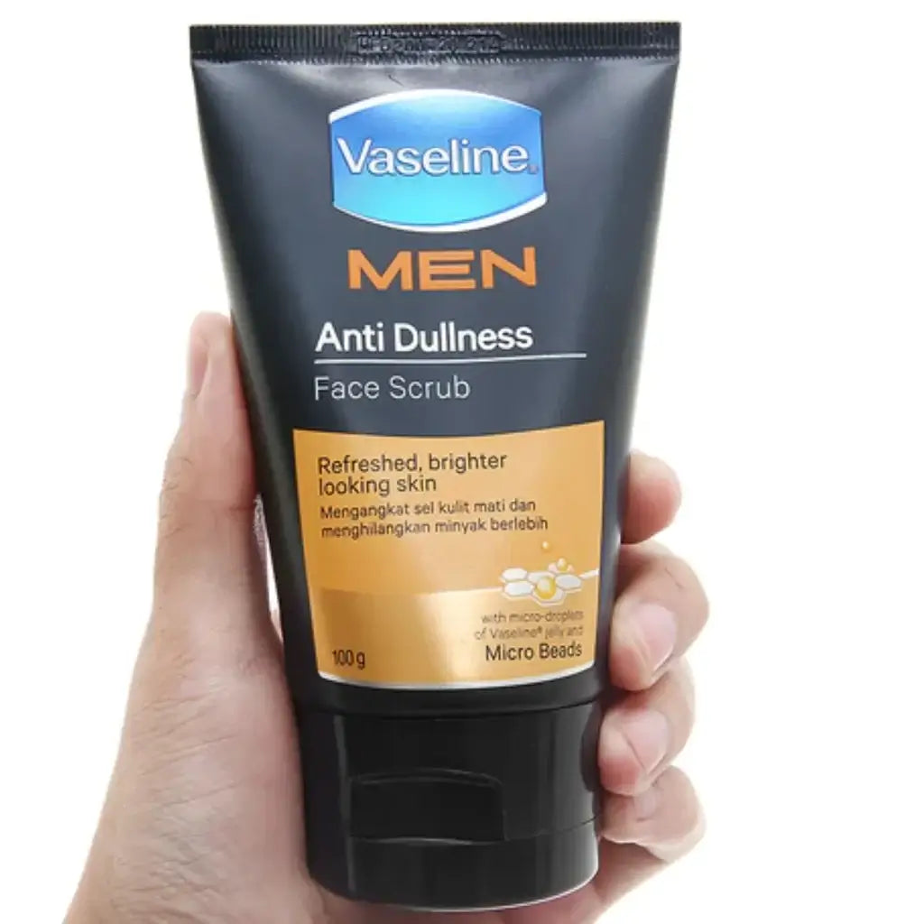 Vaseline Men Face Scrub held in hand