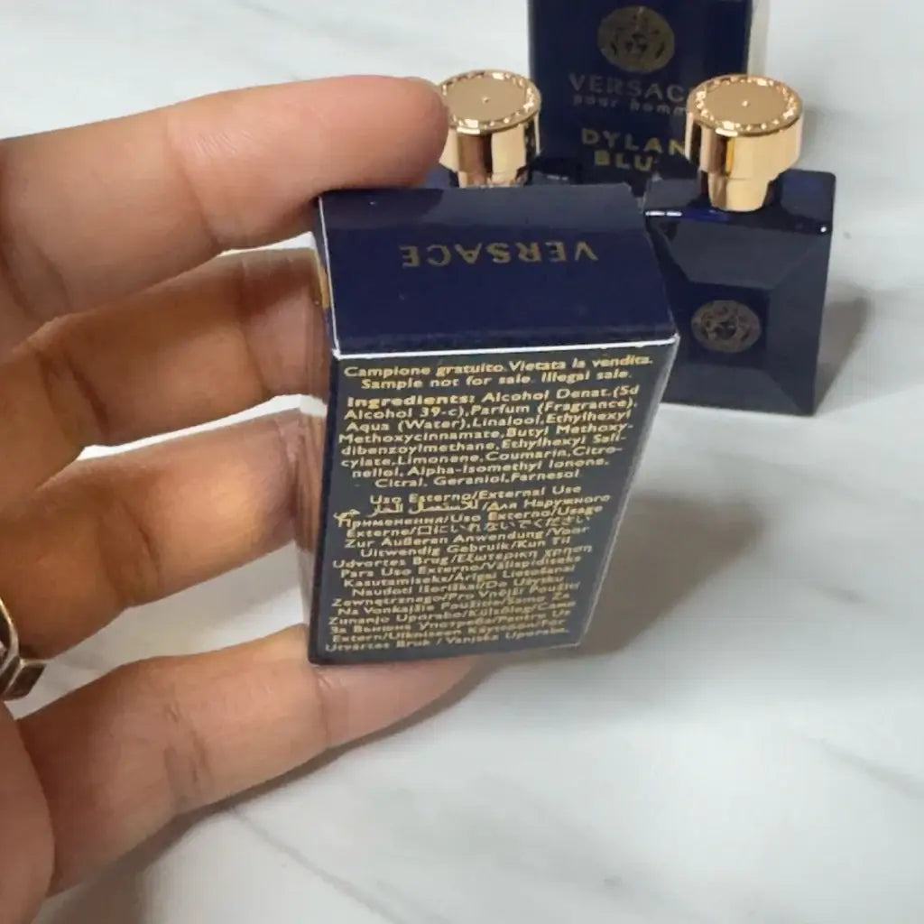 The back of a Versace Dylan Blue Pour Homme EDT perfume box showing ingredients.