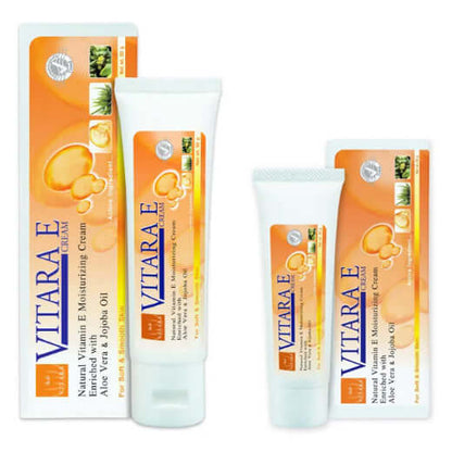 Two tubes 25,50ml and packaging boxes of Vitara E Moisturizing Cream with natural vitamin E, aloe vera, and jojoba oil.