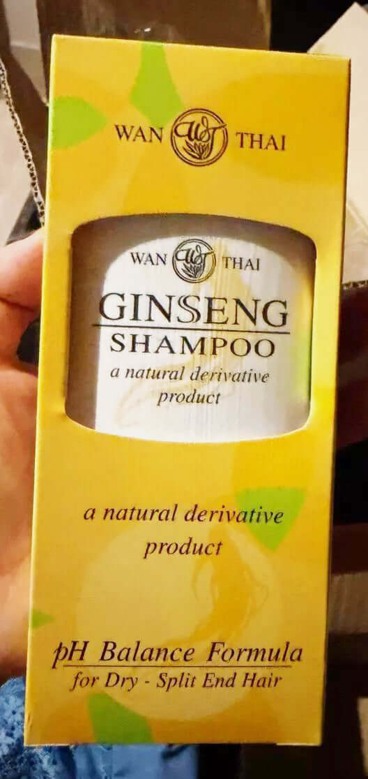 Wan Thai Ginseng Shampoo packaging showcasing natural derivative product for dry, split-end hair with pH balance formula.