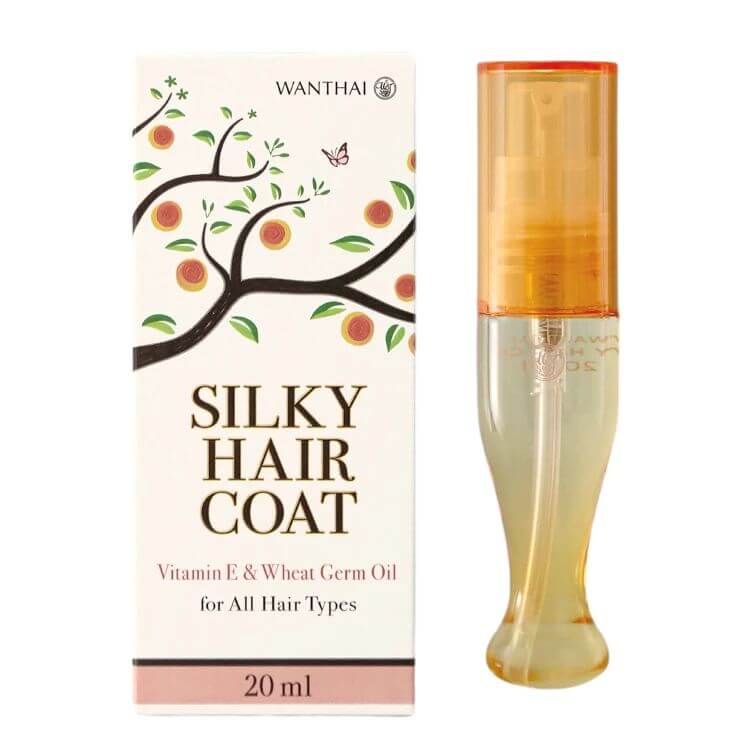 A slender glass bottle of Wanthai Silky Hair Coat 20ml standing upright beside its product packaging box.