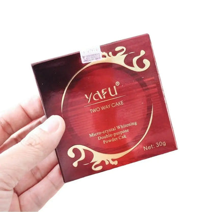 Hand holding Yafu Two Way Cake product packaging box