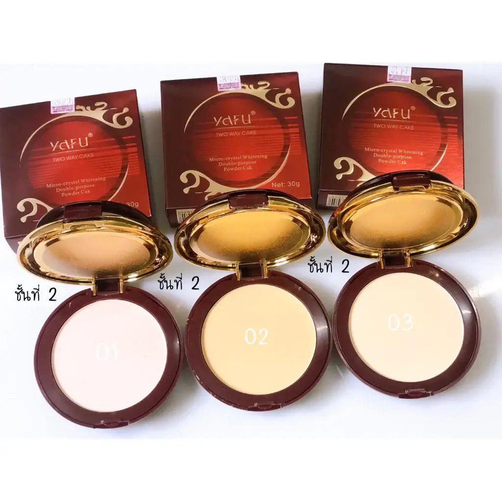 Three shades of Yafu Two Way Cake compact powder displayed with their original boxes