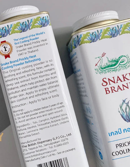 Snake Brand Prickly Heat Cooling Powder Kelp Complex tin showing product labels and ingredients on the side.
