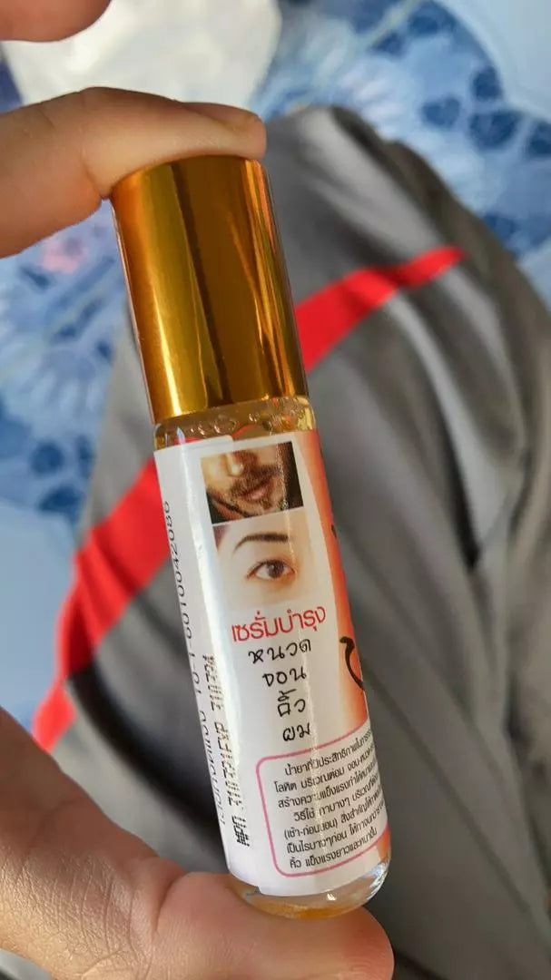Genive Hair Growth Serum 10ml bottle handheld natural lighting