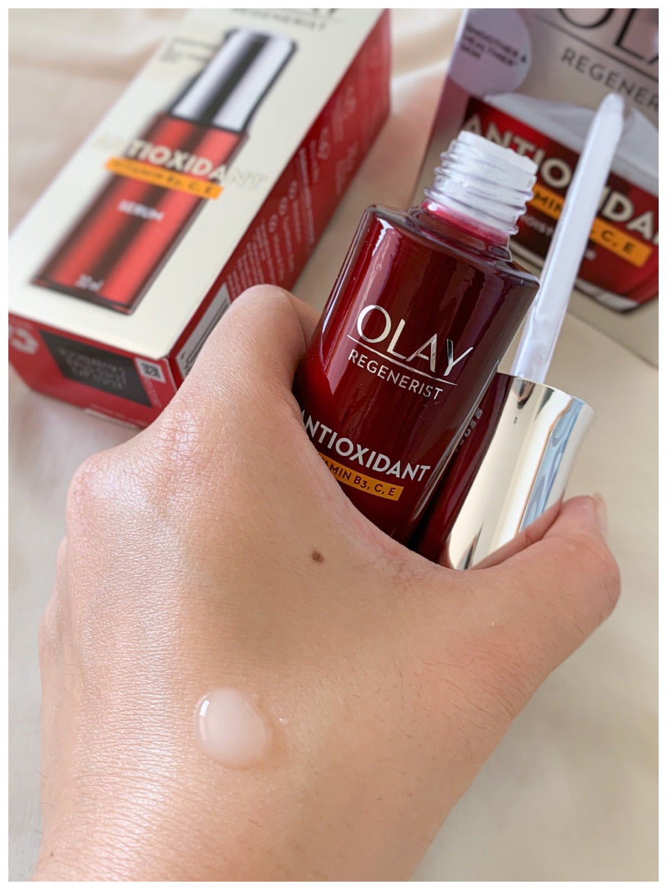 Olay Regenerist Antioxidant Serum applied on skin to show lightweight texture and absorption
