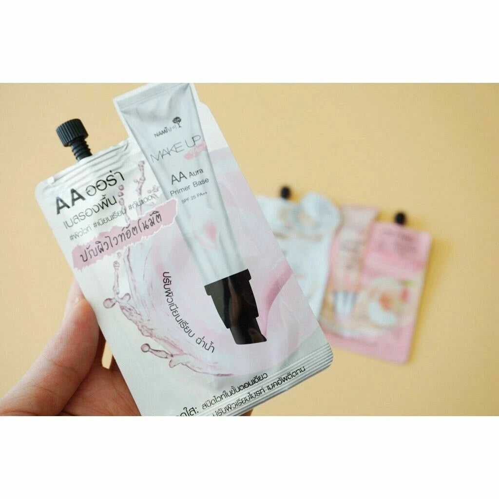 Nami Make Up Pro AA Aura primer base sachets hand holding view