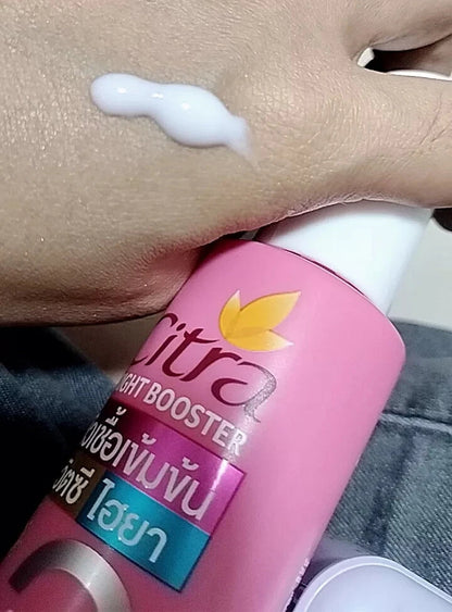 Citra Bright Booster Serum applied on hand, showcasing lightweight formula with Vitamin C and Hya for skin radiance.
